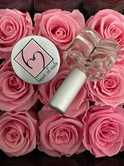 heart of nails product on field of pink roses